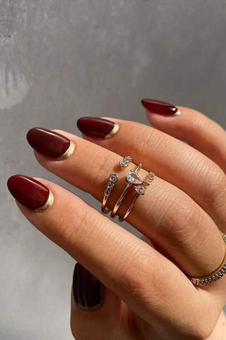 Burgundy-nails-with-gold-cuffs