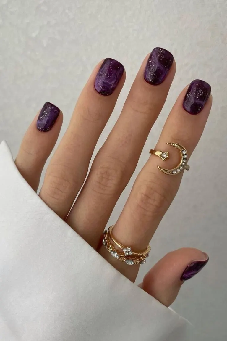 Purple glitter marble nail design