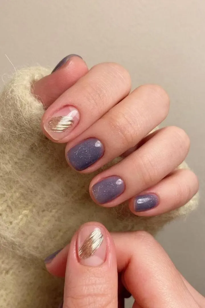 Purple nails with gold designs for autumn