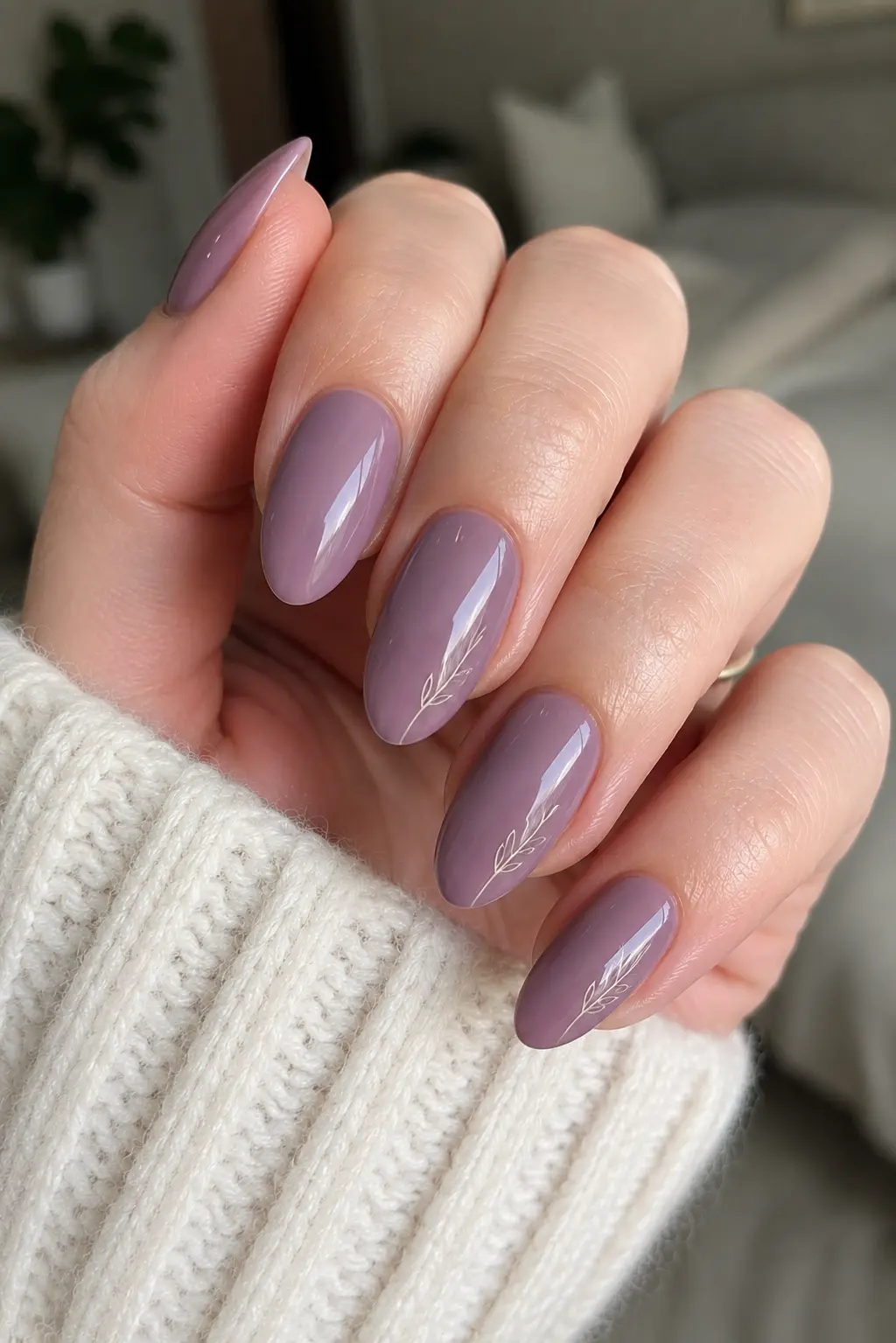 woman's hand with glossy dusty lavender almond-shaped nails featuring delicate white minimalist botanical line art,